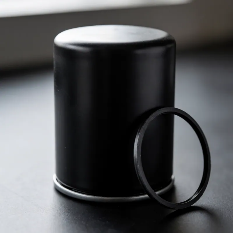 An oil filter and a service record at Woodside Car Service in Woodside, NY